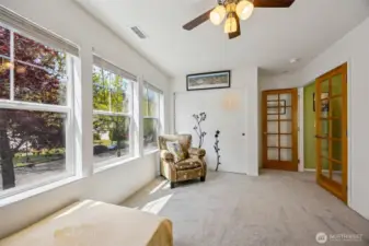 Bedroom 1 features french doors.