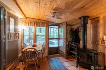 Side room has a wood stove which keeps things warm when needed.