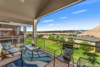 Covered patio with sweeping views - perfect for relaxing or entertaining year round
