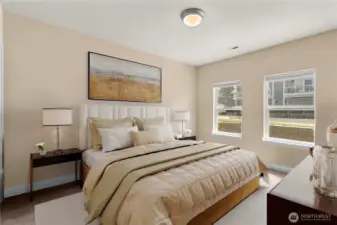 Comfortable secondary bedroom with soft natural light and ample closet space