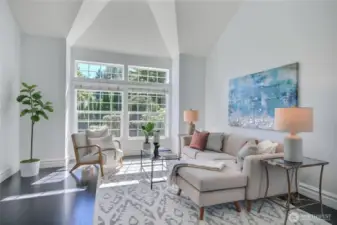 Formal living room with vaulted ceilings