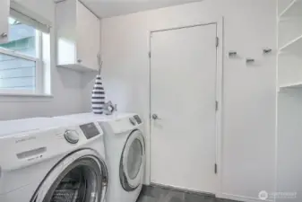 Utility room / mudroom off the garage. Washer Dryer included