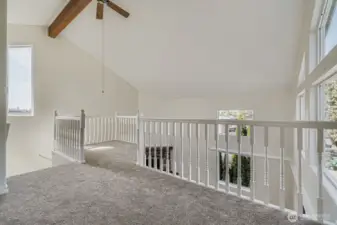 Primary suite open to vaulted ceilingings