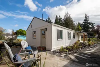 Walk out the back door onto flagstone path to garage or garden