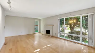 Another view of the living room without the virtual staging, offering ample space and possibilities to make this space all your own!