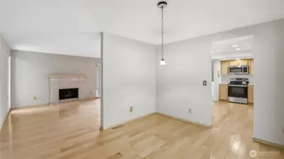 A view of the dining space with the virtual staging, enjoy being just steps from the kitchen for easy serving and cose to the living room for easy hosting.
