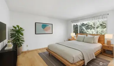 The primary offers plenty of space for all your bedroom furniture needs, plus the bonus of a walk-in closet and private en suite. (Virtually Staged)