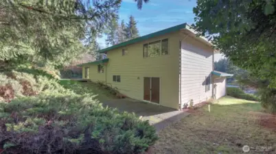 The lower level offers access to the entertainment sized patio space too easily connecting the entire backyard for even more seamless indoor/outdoor living options.