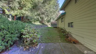 Enjoy the privacy of this tree-lined backyard, ideal for relaxing and entertaining.