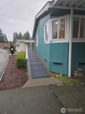 Side showing ADA ramp leading to front door