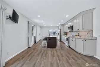 New kitchen, smart appliances, granite counters, custom cabinets.