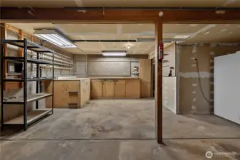 Garage has workshop space. Fridge stays