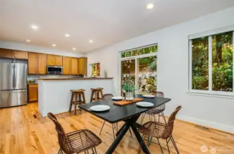 Kitchen with pantry and stainless steel appliances overlooks large dining area and is perfect for entertaining.