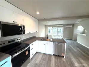 Subject property. This is a desirable end-unit offering more privacy & windows on multiple sides