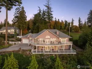 Perched above Semiahmoo Bay, this custom estate glows against a backdrop of evergreens and open sky.