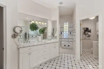 Spa-inspired bath with jet tub, shower, and dual vanities.