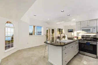 A full kitchen with island seating makes this level a true independent suite.