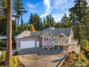 A welcoming presence with generous parking and charming coastal curb appeal.