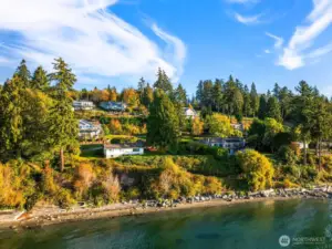 The beach below is just steps away for shoreline strolls and bonfire evenings.