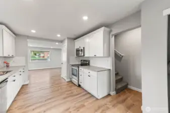 Kitchen with stairs to upper level