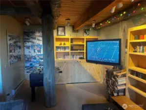 Craftsmanship runs throughout with built-ins and original log beams and pillars
