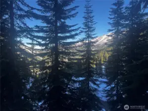 Walls of windows overlook the mountain and valley