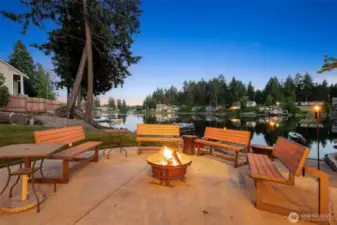 This fire pit patio is pure magic at twilight, the perfect spot to gather a crowd and soak up those serene lake views. With plenty of room for a big crew, it’s where friends and family can unwind, swap stories, and toast marshmallows under the fading light. The glow of the fire meets the calm of Long Lake, making every evening feel like a getaway without leaving home.