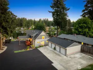 If you’ve got a fleet or plan to, this detached 4-car garage is your new best friend. With automatic openers on every door and a sprawling asphalt driveway that can fit your RV and boat plus visitors, you’ll never worry about parking again. It’s a seamless blend of function and flair, perfectly placed just steps from the home.