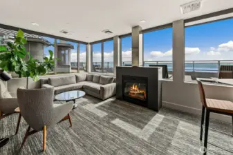 Rooftop residence lounge with gas fireplace and incredible views.