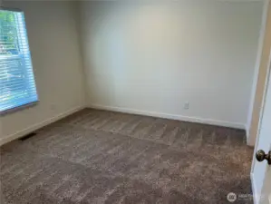 Another view of the primary bedroom.