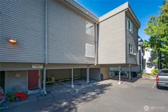 Locked red door to building. Parking #4 is in the left corner.