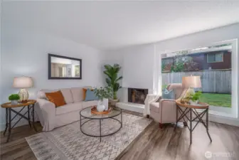 Large picture windows overlook the backyard.