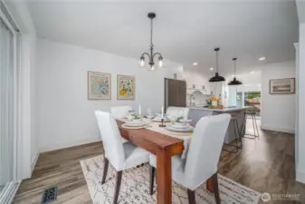 Back inside, the dining room opens into the stunning remodeled kitchen.