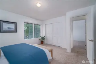 The primary bedroom features new closet doors, carpet, windows, blinds, and paint.