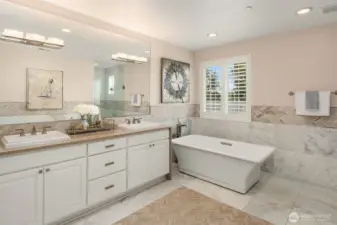 Upscale patterned tilework through out, this beautiful primary bath is a dream to have!