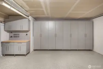 Over 20K upgrades here including epoxy floor, custom cabinets, workstation and tool racks!