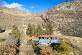 The current home site is situated at the base of a stunning natural backdrop.