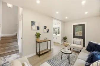 The great rooms is right off the kitchen and has the stair access to the second floor.