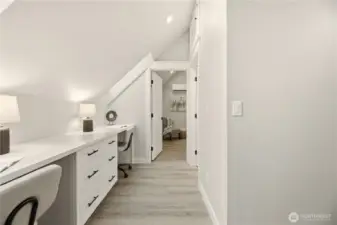 In between the bedrooms is a dedicated works space for two, along with built in drawers. This would make a great work from home space, homework area, or even crafting area. Two skylights provide more light.