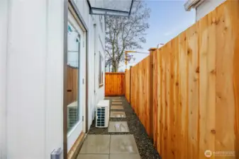 Door off the dining room with a walk way around the home.