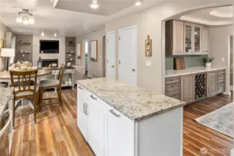 Kitchen which flows seamlessly into both the formal dining space as well as the cozy living room