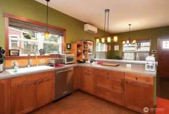 Wicander cork main flooring & Marmoleum vinyl bath flooring.  Belmont cabinets throughout.