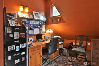 Upstairs loft area is a flexible space and has been used as an office, den and workout area.