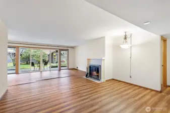 Large living room with easy access to covered patio. Seller giving $15k credit for flooring at closing.