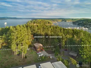 Aerial view highlighting the condo’s peaceful treehouse-like setting backing the University of Washington Preserve, offering rare privacy and protected forest surroundings just minutes from downtown Friday Harbor on San Juan Island.