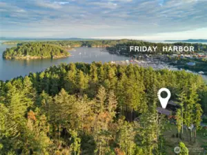 Panoramic aerial view illustrating the condo’s ideal location near Friday Harbor, with easy access to the marina, shops, restaurants, and ferry while still enjoying peaceful forest surroundings.