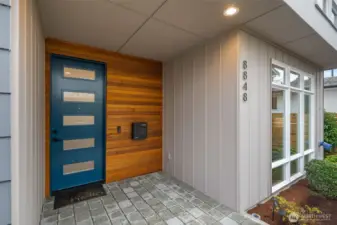 The home is beautiful inside and out. The covered entry is a gracious size with room for plants, shoes, bike storage and more.