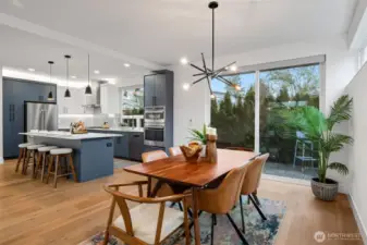 A private deck just outside the dining room and sliding doors. There are also Lutron remote blinds in both the kitchen window and the sliding doors.