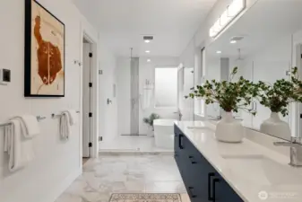 A true spa like experience in the 5-piece bath. Double sinks, quartz counters and beautiful, heated stone tile floors. A full wet room with soaking tub+ rain shower.