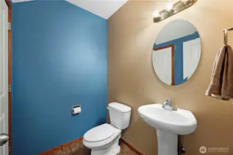 Main floor powder room with ample closet storage